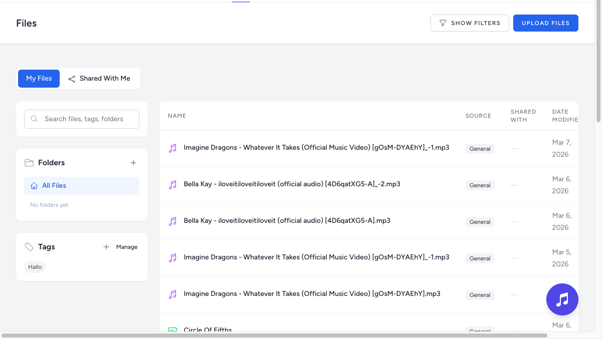 Files page with table view showing folders, tags, search, and file metadata